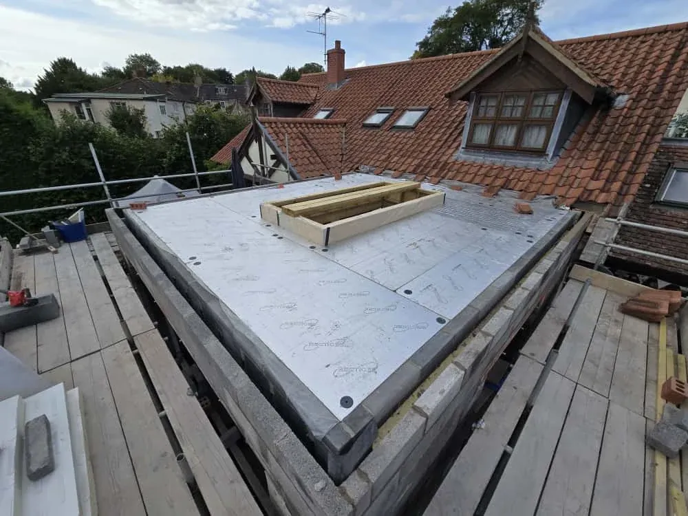 A flat roof deck with an opening formed for a lantern A flat roof deck with an opening formed for a lantern