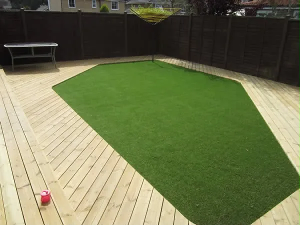 Finished decking wrapped around a rectangular lawn