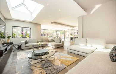 Living room with a roof lantern and garden glazing