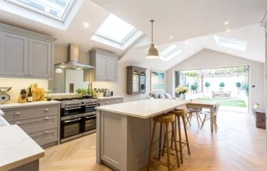 Kitchen under a vaulted ceiling with rooflights